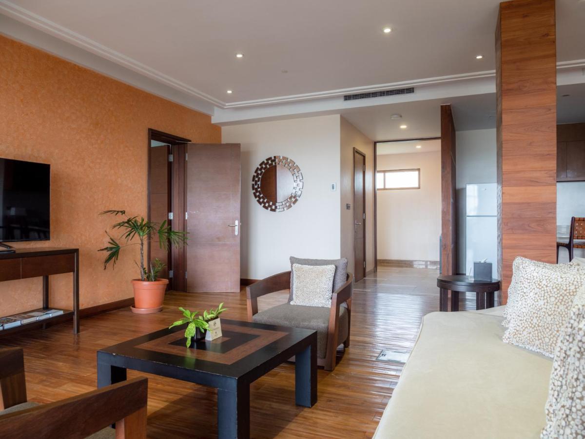 Savoy Seychelles Resort & Spa Beau Vallon  Exterior photo A living room in a suite at the hotel