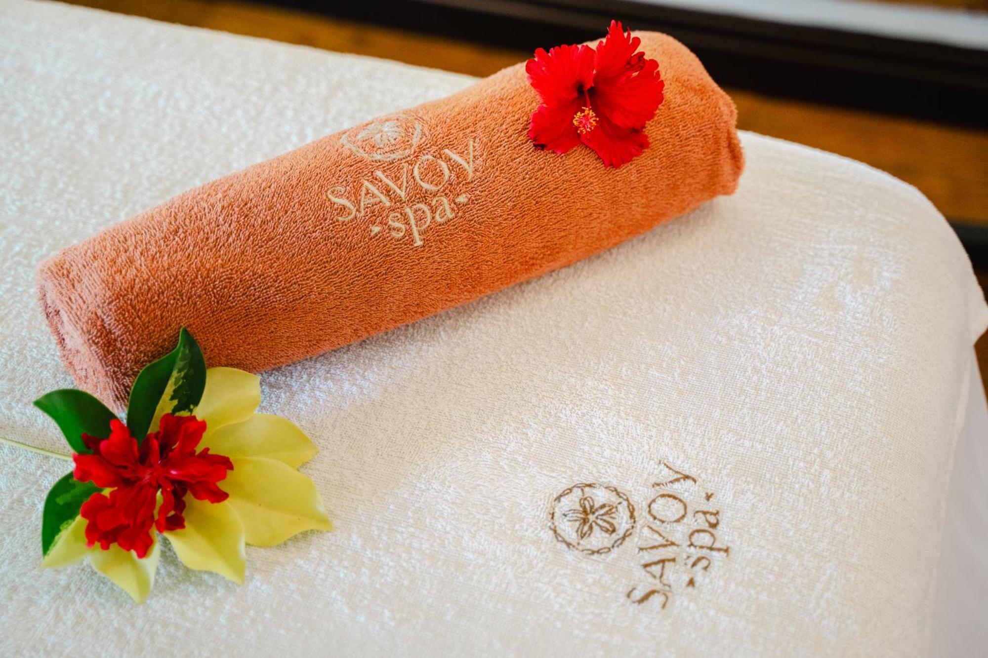 Savoy Seychelles Resort & Spa Beau Vallon  Exterior photo A towel with the Olympic logo